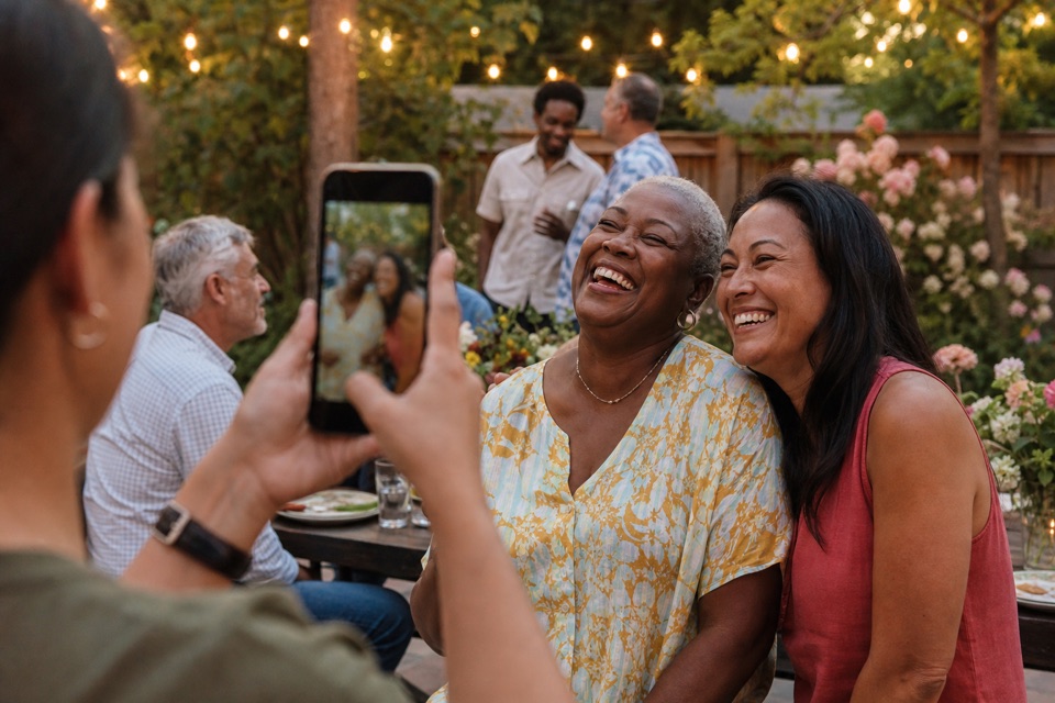 Guests sharing a candid laugh at a celebration